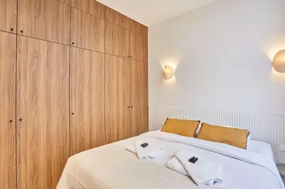 Un ou plusieurs lits dans un hébergement de l'établissement Superb AC Apartment Center of Paris
