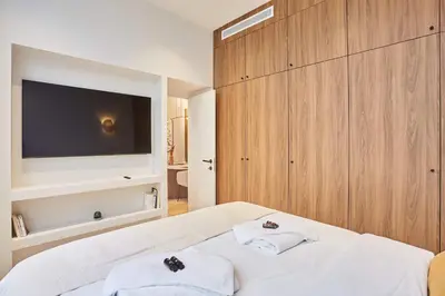 Un ou plusieurs lits dans un hébergement de l'établissement Superb AC Apartment Center of Paris