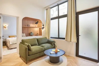 Un ou plusieurs lits dans un hébergement de l'établissement Superb AC Apartment Center of Paris