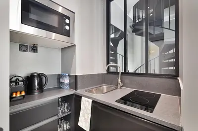 Cuisine ou kitchenette dans l'établissement LaSuite Montmartre
