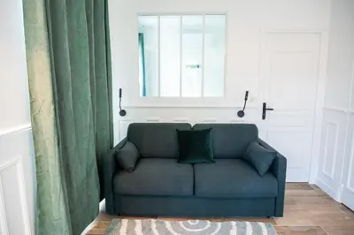 Coin salon dans l'établissement Cosy suite with a terrasse in a calm area
