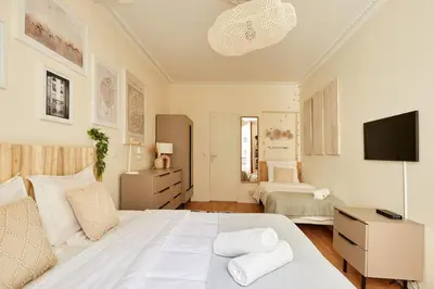 Un ou plusieurs lits dans un hébergement de l'établissement Lovely flat Marais - Orange