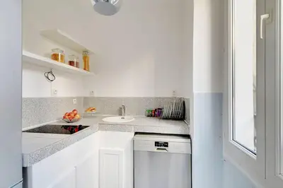 Cuisine ou kitchenette dans l'établissement Bastille - Marais Apartment