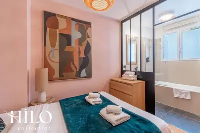 Un ou plusieurs lits dans un hébergement de l'établissement Suite Paris Zola by HILO Collection - 4 people - 35m2