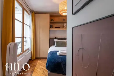 Un ou plusieurs lits dans un hébergement de l'établissement Suite Paris Stendhal by HILO Collection - 6people - 70m2