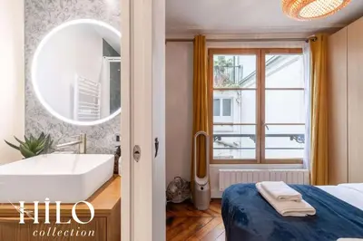 Un ou plusieurs lits dans un hébergement de l'établissement Suite Paris Stendhal by HILO Collection - 6people - 70m2