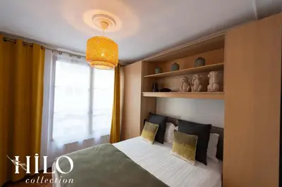 Un ou plusieurs lits dans un hébergement de l'établissement Suite Paris Stendhal by HILO Collection - 6people - 70m2