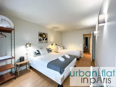 Un ou plusieurs lits dans un hébergement de l'établissement Urban Flat 133 - Ponceau 4 Bedroom Apartment