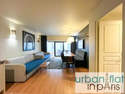 Coin salon dans l'établissement Urban Flat 133 - Ponceau 4 Bedroom Apartment
