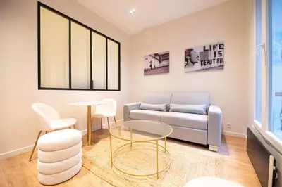 Coin salon dans l'établissement 1 BR Saint Germain Luxembourg Garden