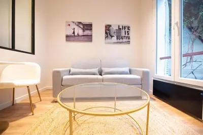Coin salon dans l'établissement 1 BR Saint Germain Luxembourg Garden
