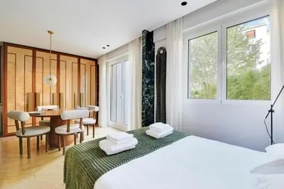 Un ou plusieurs lits dans un hébergement de l'établissement Super studio 4P avec jardin - Neuilly sur Seine