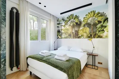 Un ou plusieurs lits dans un hébergement de l'établissement Super studio 4P avec jardin - Neuilly sur Seine