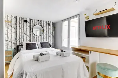 Un ou plusieurs lits dans un hébergement de l'établissement BM-Studio lumineux pour 2 parfait a Paris