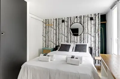 Un ou plusieurs lits dans un hébergement de l'établissement BM-Studio lumineux pour 2 parfait a Paris