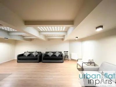 Coin salon dans l'établissement Urban Flat 139 - Duplex Flat Saint-Germain