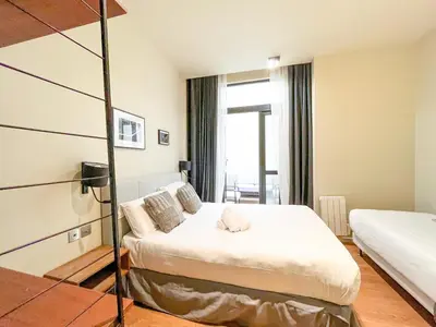 Un ou plusieurs lits dans un hébergement de l'établissement Urban Flat 139 - Duplex Flat Saint-Germain