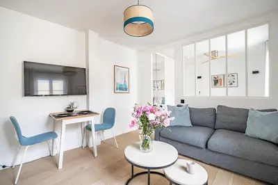 Coin salon dans l'établissement Cozy apartment, center of Paris