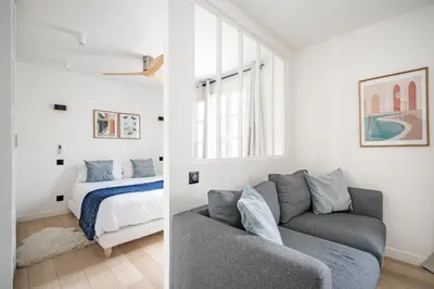 Un ou plusieurs lits dans un hébergement de l'établissement Cozy apartment, center of Paris