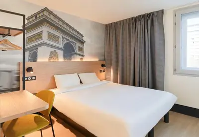 Un ou plusieurs lits dans un hébergement de l'établissement B&B HOTEL Paris Italie Porte de Choisy