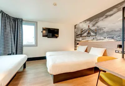 Un ou plusieurs lits dans un hébergement de l'établissement B&B HOTEL Paris Italie Porte de Choisy
