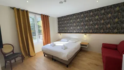 Un ou plusieurs lits dans un hébergement de l'établissement Alma Hotel
