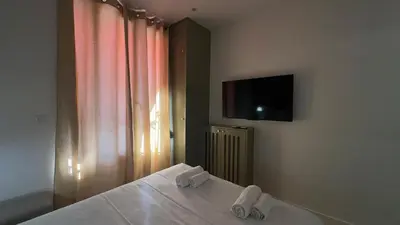 Télévision ou salle de divertissement dans l'établissement Alma Hotel