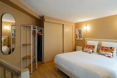Un ou plusieurs lits dans un hébergement de l'établissement Duplex climatisé - Grands Boulevards