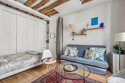 Un ou plusieurs lits dans un hébergement de l'établissement Joli studio grand et calme, Marais