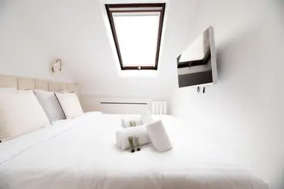 Un ou plusieurs lits dans un hébergement de l'établissement CIA - Modern Flat, Galeries Lafayette