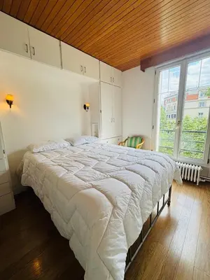 Un ou plusieurs lits dans un hébergement de l'établissement Appartement Porte d'Orléans Paris
