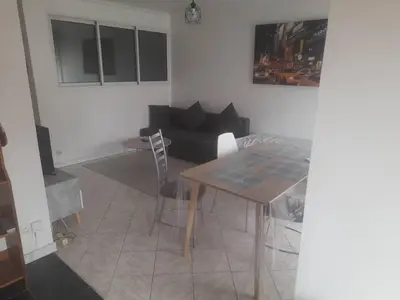 Coin salon dans l'établissement Appartement calme & proche Paris
