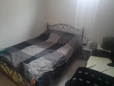 Un ou plusieurs lits dans un hébergement de l'établissement Appartement calme & proche Paris