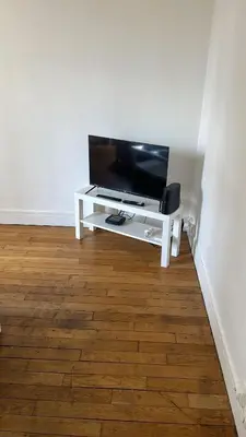 Télévision ou salle de divertissement dans l'établissement Appartement proche Roland Garros
