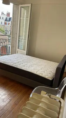 Un ou plusieurs lits dans un hébergement de l'établissement Appartement proche Roland Garros