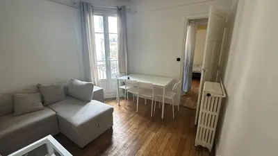Coin salon dans l'établissement Appartement proche Roland Garros