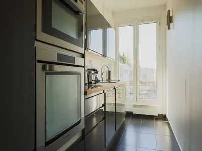Cuisine ou kitchenette dans l'établissement Charming flat -1BR-4P- Paris 17e