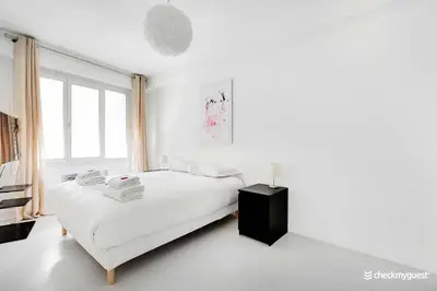 Un ou plusieurs lits dans un hébergement de l'établissement Amazing apartment - 3BR 6P - Near Convention