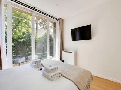 Un ou plusieurs lits dans un hébergement de l'établissement Magnificent 2BD 6P apartment - Eiffel Tower
