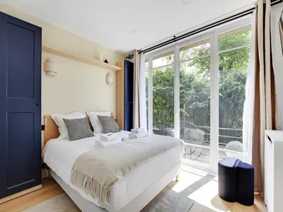 Un ou plusieurs lits dans un hébergement de l'établissement Magnificent 2BD 6P apartment - Eiffel Tower