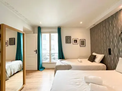 Un ou plusieurs lits dans un hébergement de l'établissement Urban Flat 104 - 4 Bedroom Flat Opera