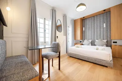 Un ou plusieurs lits dans un hébergement de l'établissement Luxury Studio - Louvre, Palais Royal - CIA