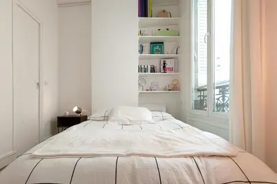 Un ou plusieurs lits dans un hébergement de l'établissement Cosy apartment in the 11th arrondissement