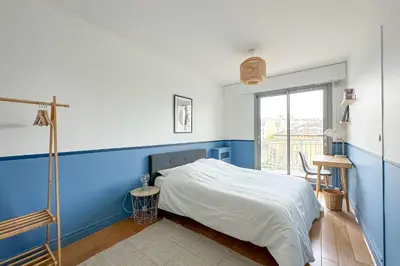 Un ou plusieurs lits dans un hébergement de l'établissement Beautiful private room in a Parisian shared apartment - Flexliving
