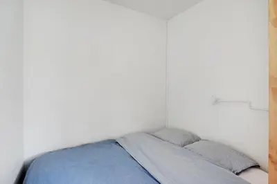 Un ou plusieurs lits dans un hébergement de l'établissement Studio Dumas - Charonne by B'Your Home