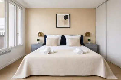 Un ou plusieurs lits dans un hébergement de l'établissement Spacieux Appartement à Issy Les Moulineaux