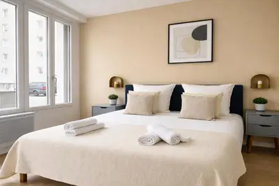 Un ou plusieurs lits dans un hébergement de l'établissement Spacieux Appartement à Issy Les Moulineaux