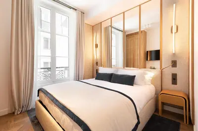 Un ou plusieurs lits dans un hébergement de l'établissement Oniri - Serviced Apartments in Louvre - Rue de Richelieu