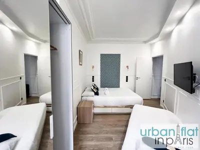 Un ou plusieurs lits dans un hébergement de l'établissement Urban Flat 107 - Sublime 4 Bedroom Opera Paris