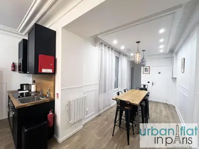Cuisine ou kitchenette dans l'établissement Urban Flat 107 - Sublime 4 Bedroom Opera Paris